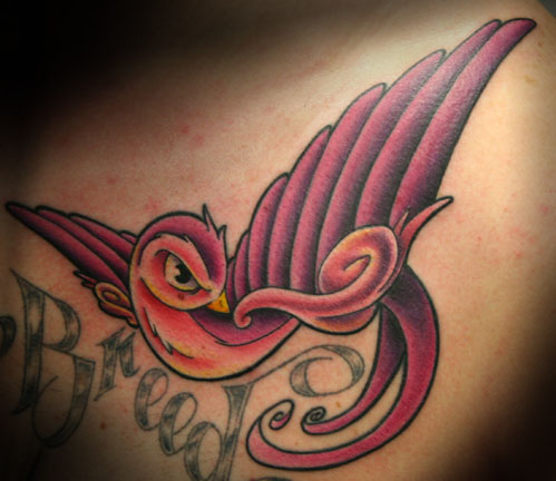 I was thinking of a swallow sparrow on the side of my ribs with music notes